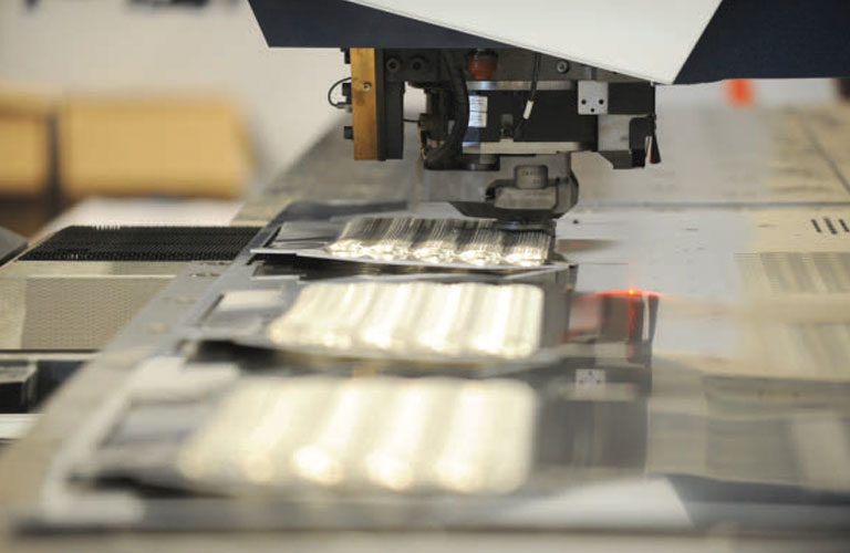 On the shop flop, form tools on the punch press create treads for a safety platform.